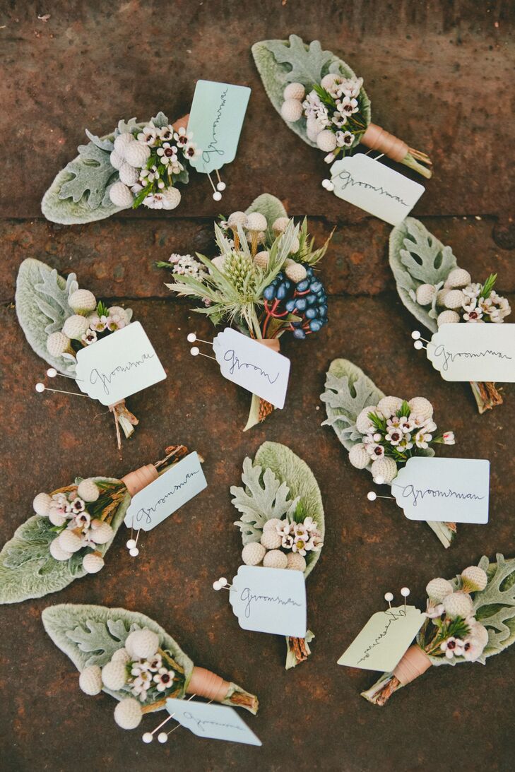 The boutonnieres worn by Kyle and his groomsmen all incorporated silver brunia and dusty miller into the natural-looking mix. Kyle's arrangement stood out with berries incorporated into the arrangement, adding a pop of color to his boutonniere.