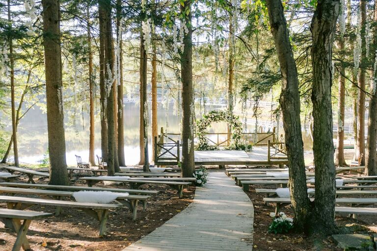 Curved aisle heading to lakeside ceremony space