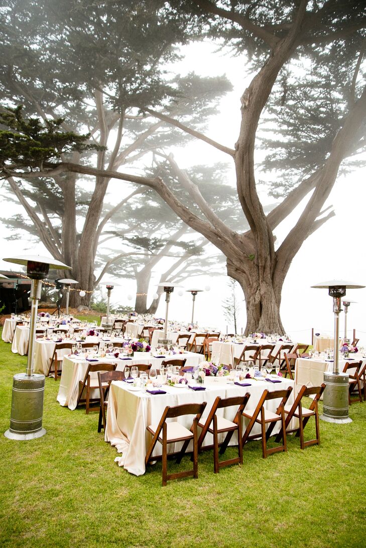 With large trees overhead, guests enjoyed their reception meal on long tables set with ivory linens.
