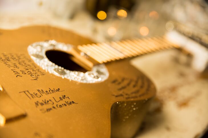 Instead of having their family and friends sign a traditional guest book, Galina and Andrew had them write their well wishes on an acoustic guitar.