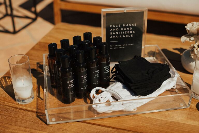 Hand sanitizer and masks at wedding ceremony