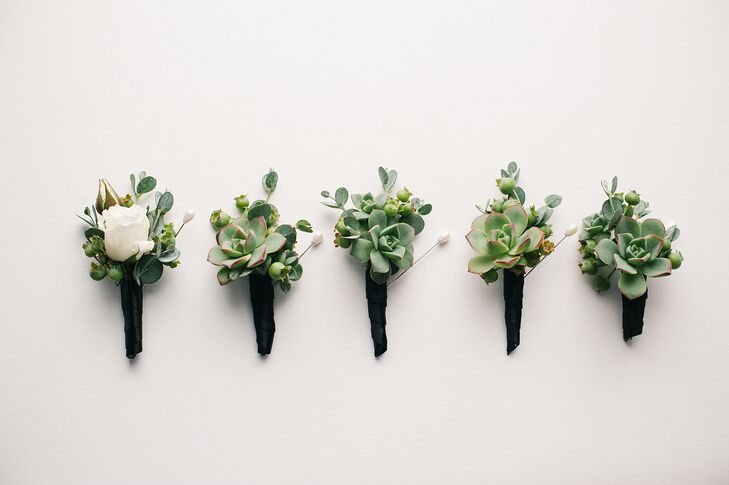 The groomsmen sported green boutonnieres with succulents and unripened blueberries to honor the bride's late father.