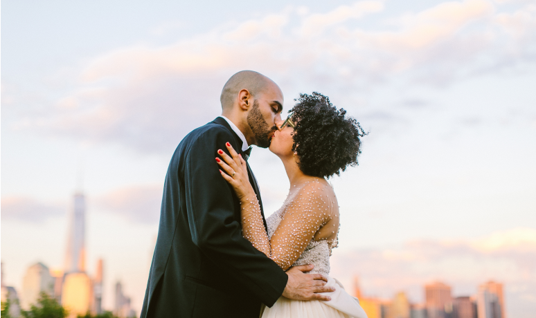 newlyweds celebrating with a kiss