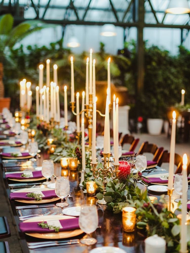 romantic tablescape with taper candles and eucalyptus garland