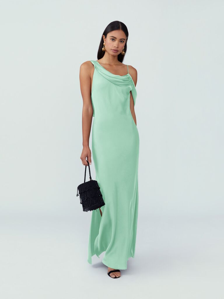 Model wears a mint-green off-the-shoulder gown. 