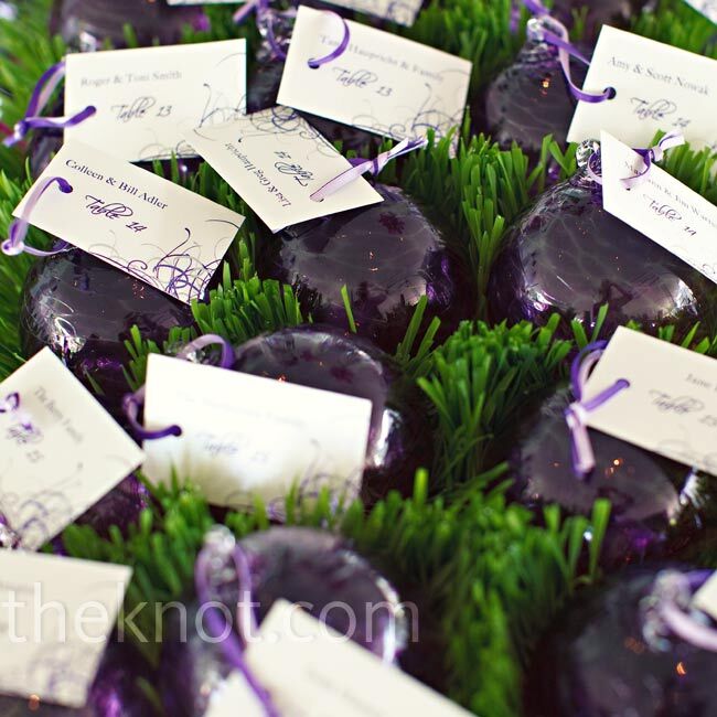 Handblown glass ornaments were tagged with escort cards and doubled as unique favors.