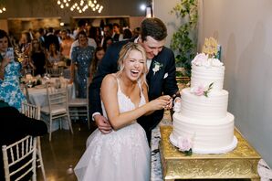 Couple Laughing While Cutting Cake at Canyonwood Ridge in Dripping Springs, Texas