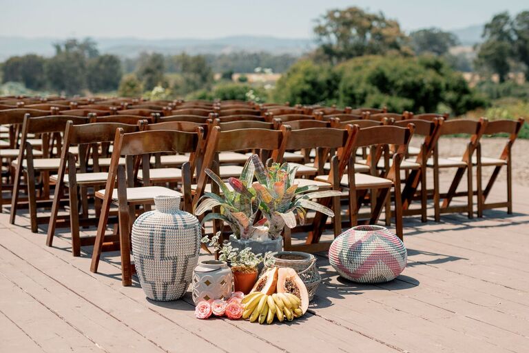Woven basket and fresh fruit wedding ceremony decorations