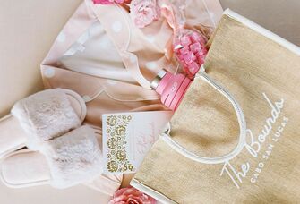 Bridesmaid gift bag with slippers, pajamas, a water bottle and candy