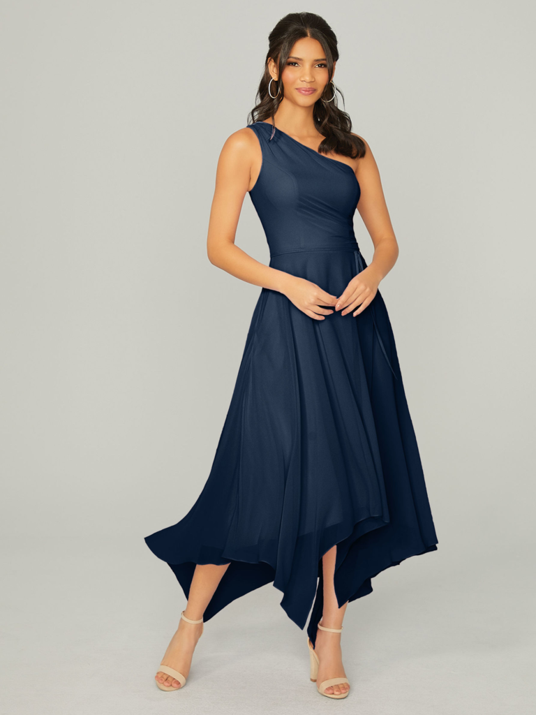 A model showcases a one-shoulder dress with an asymmetrical hemline.