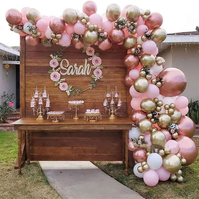 A beautiful pink and gold balloon arch.