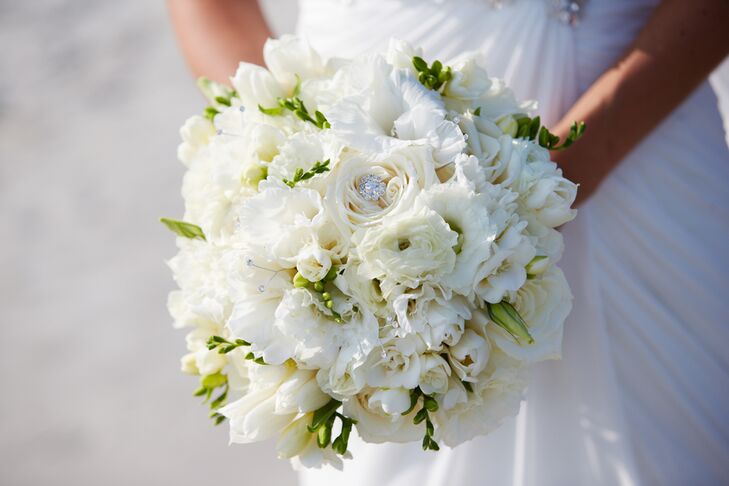 "My bouquet was composed of a variety of full white flowers including roses, freesia, glad blooms, rannunculus, tulips, lisianthus with a touch of sparkle," says Stephanie.