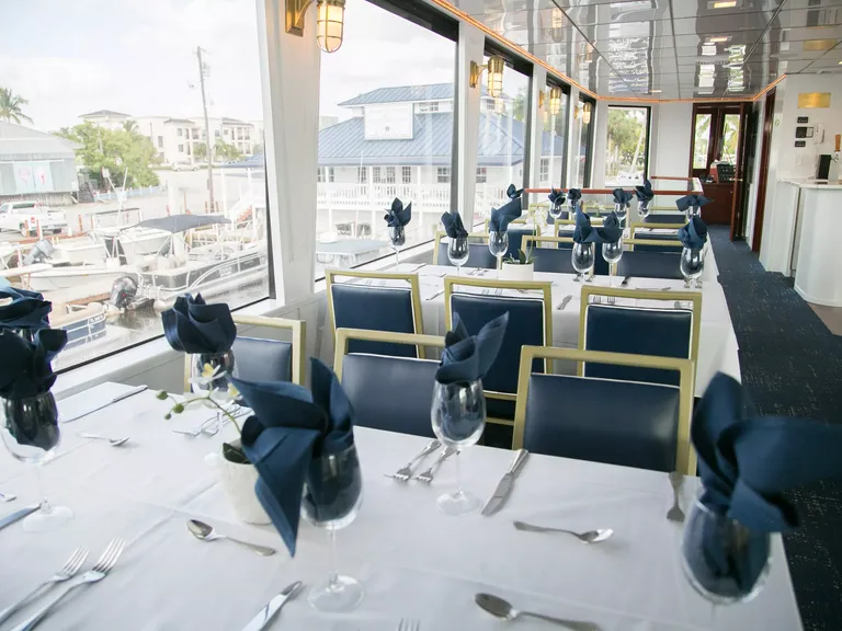 Reception space with navy decor on Naples Princess