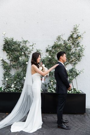 Traditional First Look with Greenery Arrangement Backdrop