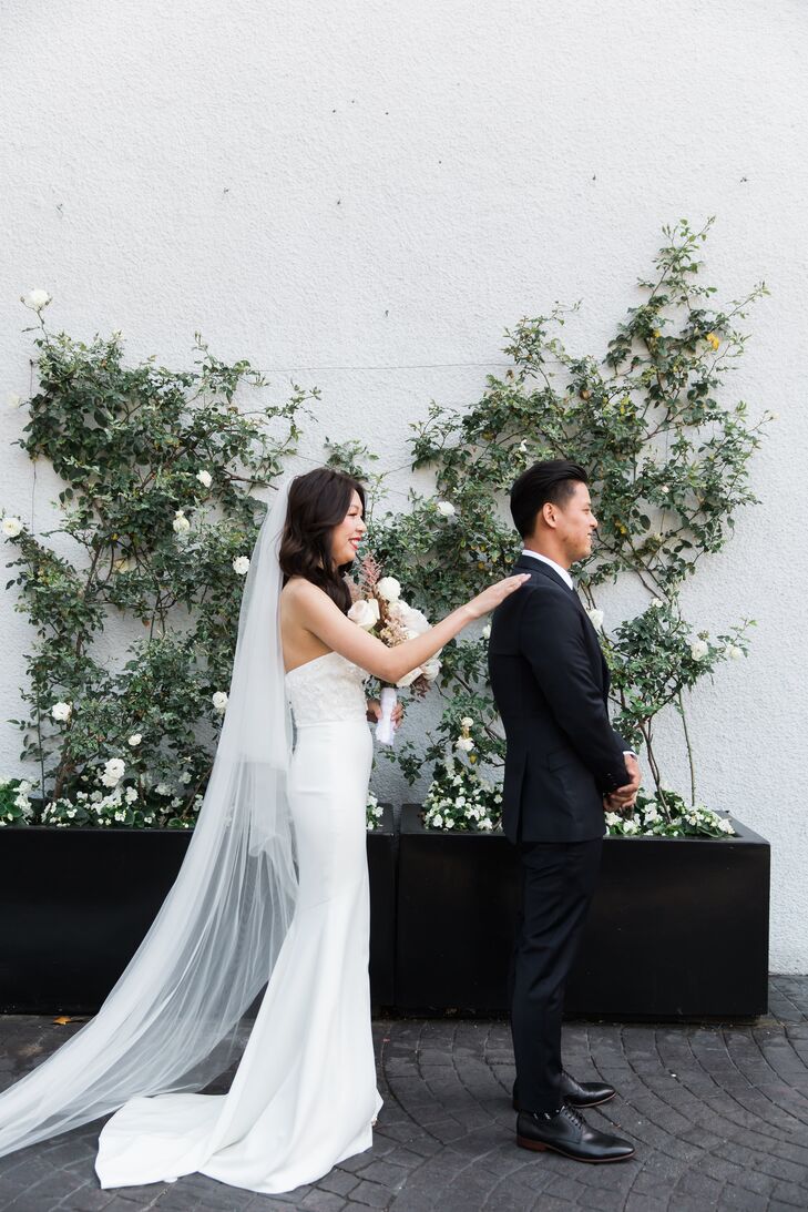 Traditional First Look with Greenery Arrangement Backdrop