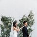 Traditional First Look with Greenery Arrangement Backdrop