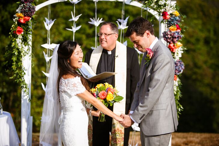 Eriko and Rob exchanged vows beneath a whimsical trellised wedding arch on the day of their ceremony.
