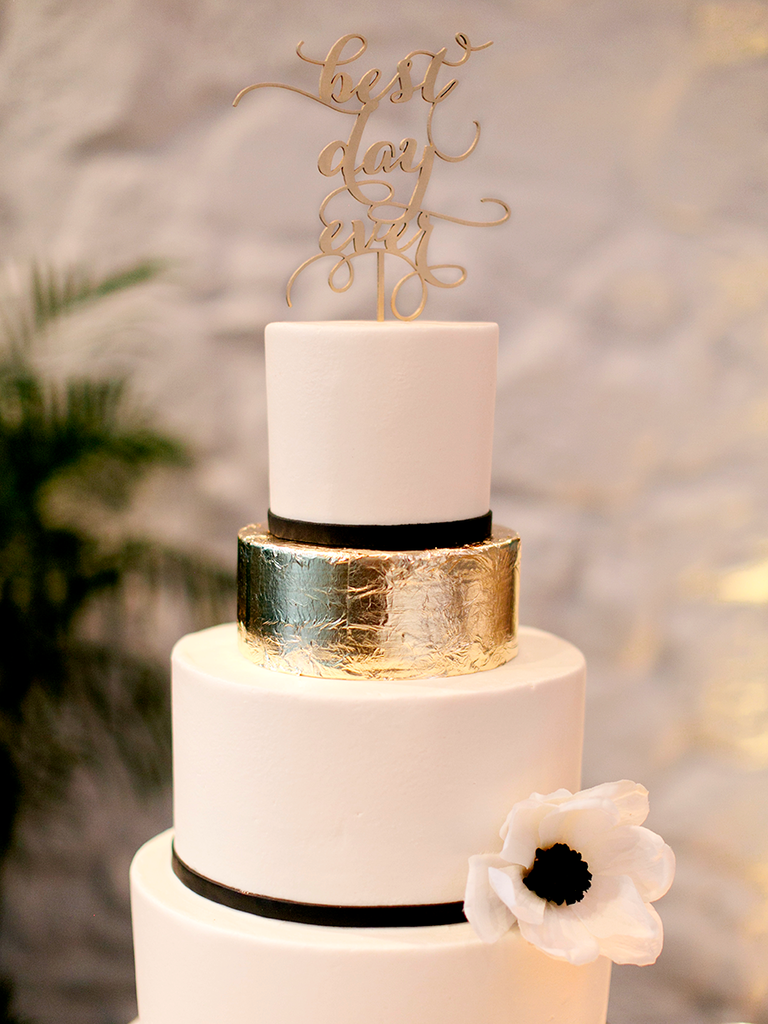 Black and white wedding cake with an accented gold foil tier