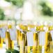 "Our favors were rosemary-infused olive oil bottles and individual olive loaves from a local bakery. I loved the idea of doubling the olive oil bottles as escort cards, having guests find their bottle, and then be greeted at their seat by a pairing loaf. Personalized menus also doubled as place cards," says Anne.

