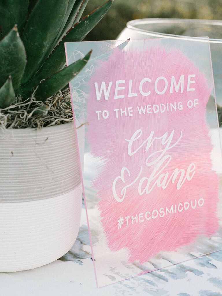 Custom wedding signage with wedding hashtag on glass