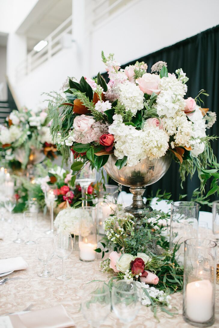 Brianna from Fox & Fern Floral amped up the centerpieces by adding tons of roses, hydrangeas and leafy greens to the mix. "I loved giving Brianna full control of how the reception was decorated," Claire says. "One of my favorite parts of the night was walking into the room to see everything decorated and set up for the first time."