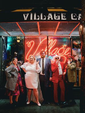 Bride, Groom and Elopement Party Guests Stylish Posing Outside Diner