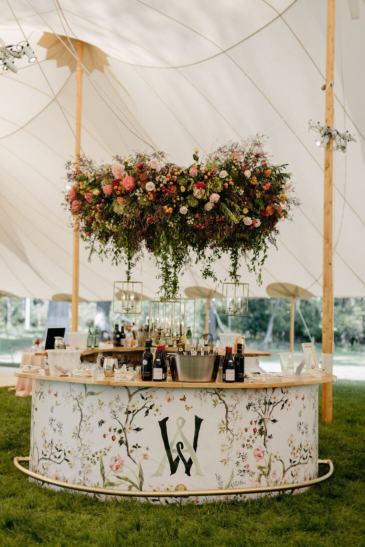 Reception Bar With Floral Chandelier and Custom Monogrammed Floral Bar Front