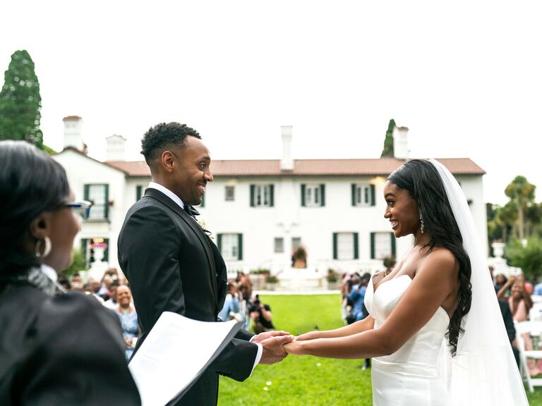 officiant speaking to couple during wedding ceremony