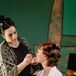 Bride in White Robe and Her Short Hair in Curlers Getting Her Makeup Done