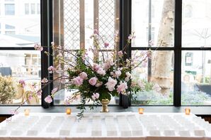 Escort Card Table with Pink Peony and Cherry Blossom Arrangement