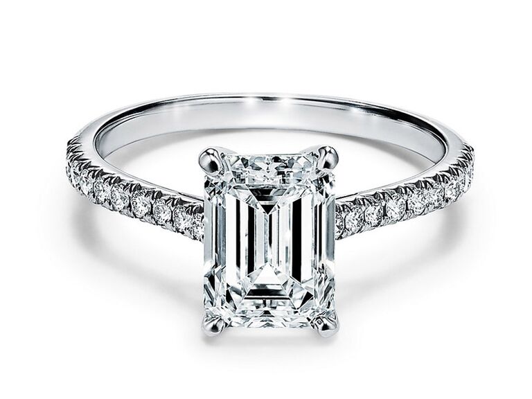 tiffany and co. emerald cut diamond engagement ring with claw prongs and round diamond platinum band