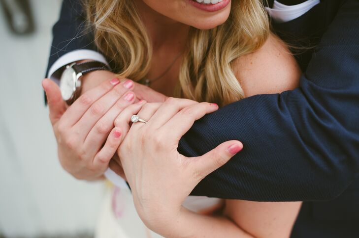 Lauren's beautiful engagement ring with a round-cut diamond glistened throughout the day's events, detailed with vintage designs that she absolutely loved.