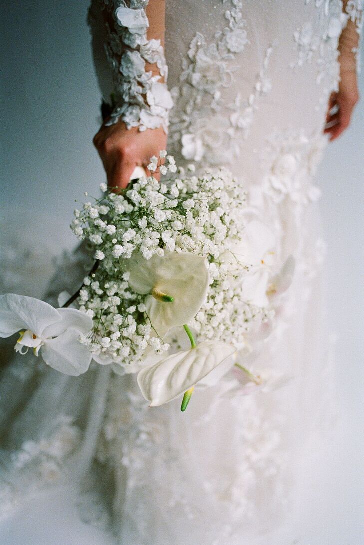 Delicate White Bridal Bouquet With Orchids and Complimenting Flowers
