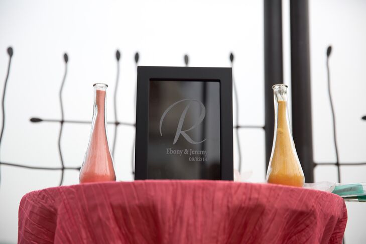Sharing this day with their family and friends was the most important part. Keeping this and their waterfront setting in mind, they chose only minimal decor. Twin bulb vases of coral or orange sand accented the altar before their unity ceremony.