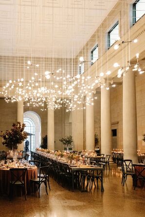 Museum Reception Space With Light Installation and Long Tables