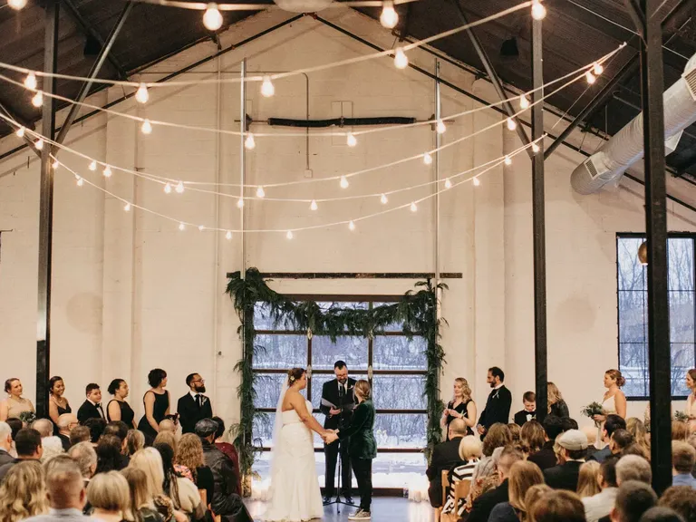 White Barn Decorated for a Winter Wedding Ceremony