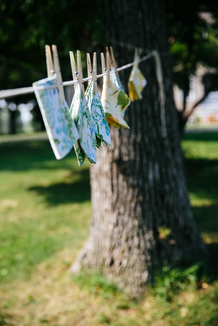To go with their retro homespun wedding, Katie and Matt hung folded linen napkins on a clothesline with each guest’s name wood-burned into the clothespin. The alternative escort cards were an adorable twist on tradition, and such a fun way for guests to find their seats.