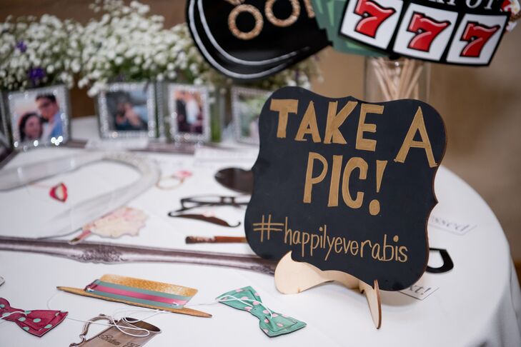 The couple’s cocktail hour was held in cactus alley, their favorite part at Springs Preserve in Las Vegas, Nevada. Tables were decorated with handmade baby’s breath centerpieces and both lighthearted and serious photos of Anna and Marc. A photo booth featured Vegas-style props.