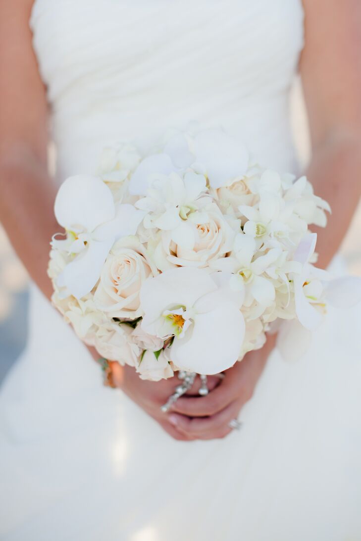 Kelsey carried an all-white bouquet of orchids, roses and gardenias.