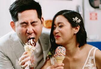 The newlyweds enjoy cones of soft-serve ice cream. 