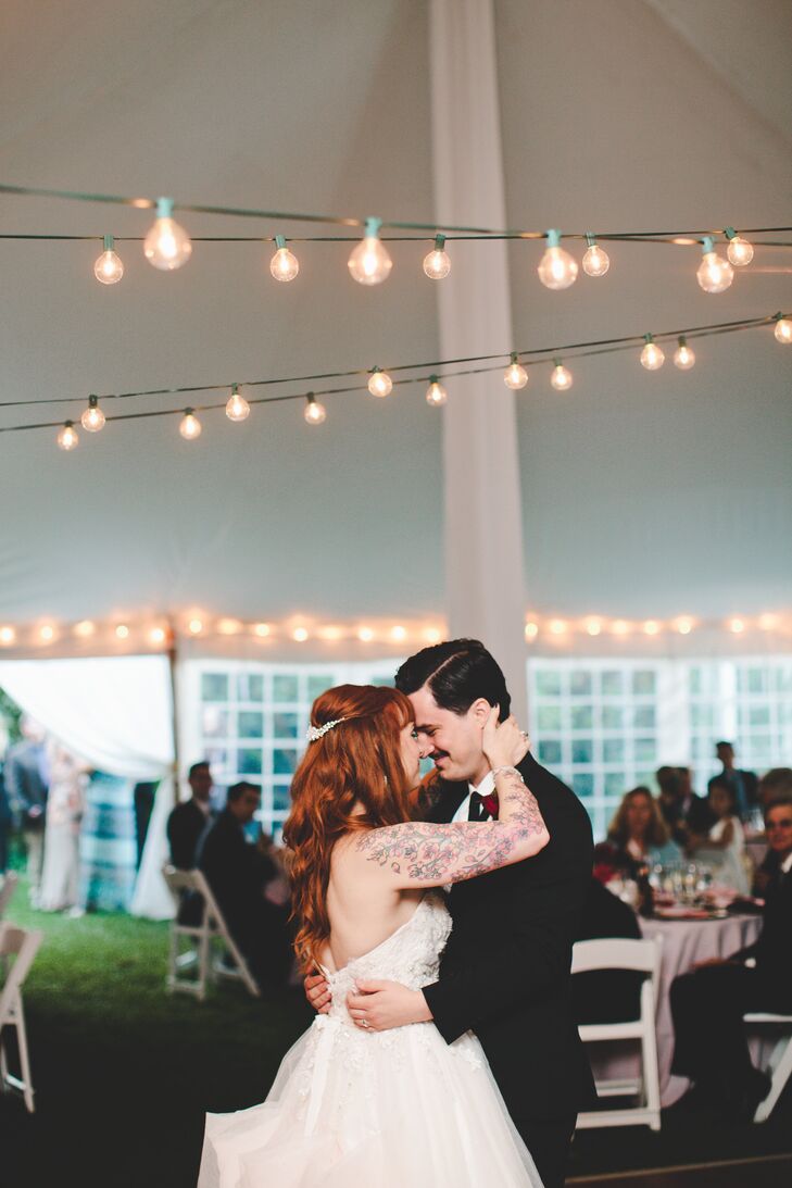 The couple's first dance song was Never Tear Us Apart by INXS. The lyrics are so beautiful and the strings in the arrangement make it feel very dramatic and romantic, says Julia.