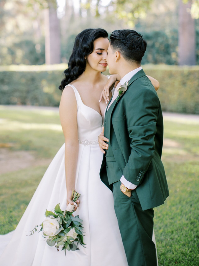 Couple sharing embrace on wedding day