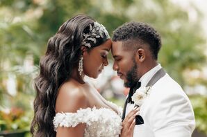 Bride With Wavy Down Hairstyle, Gem Hairpiece and Groom in White-and-Black Tuxedo Embracing