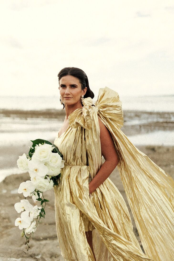 Bride in Dramatic Gold Wedding Dress With Bow