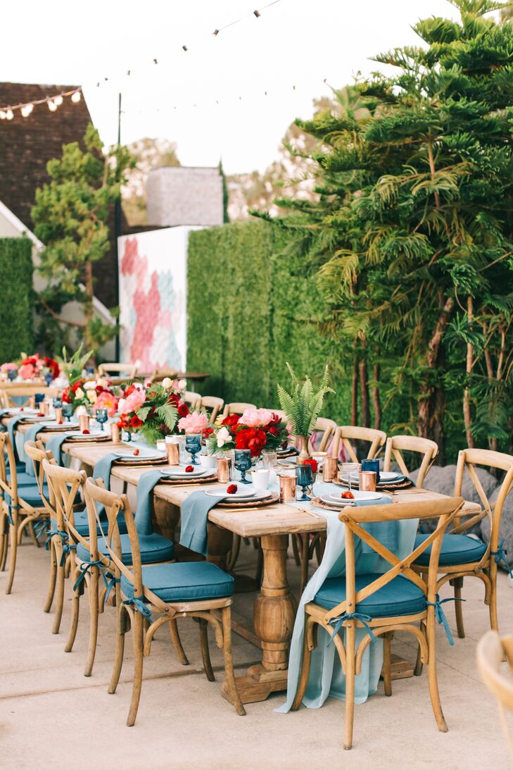 Shades of teal inspired by the California coast and mixed metallics livened up the rich wood tables.