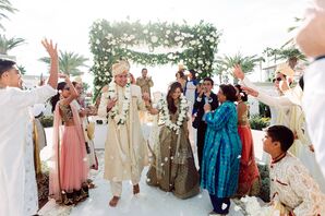 Couple Recessing as Guests Toss Rose Petals