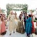 Couple Recessing as Guests Toss Rose Petals