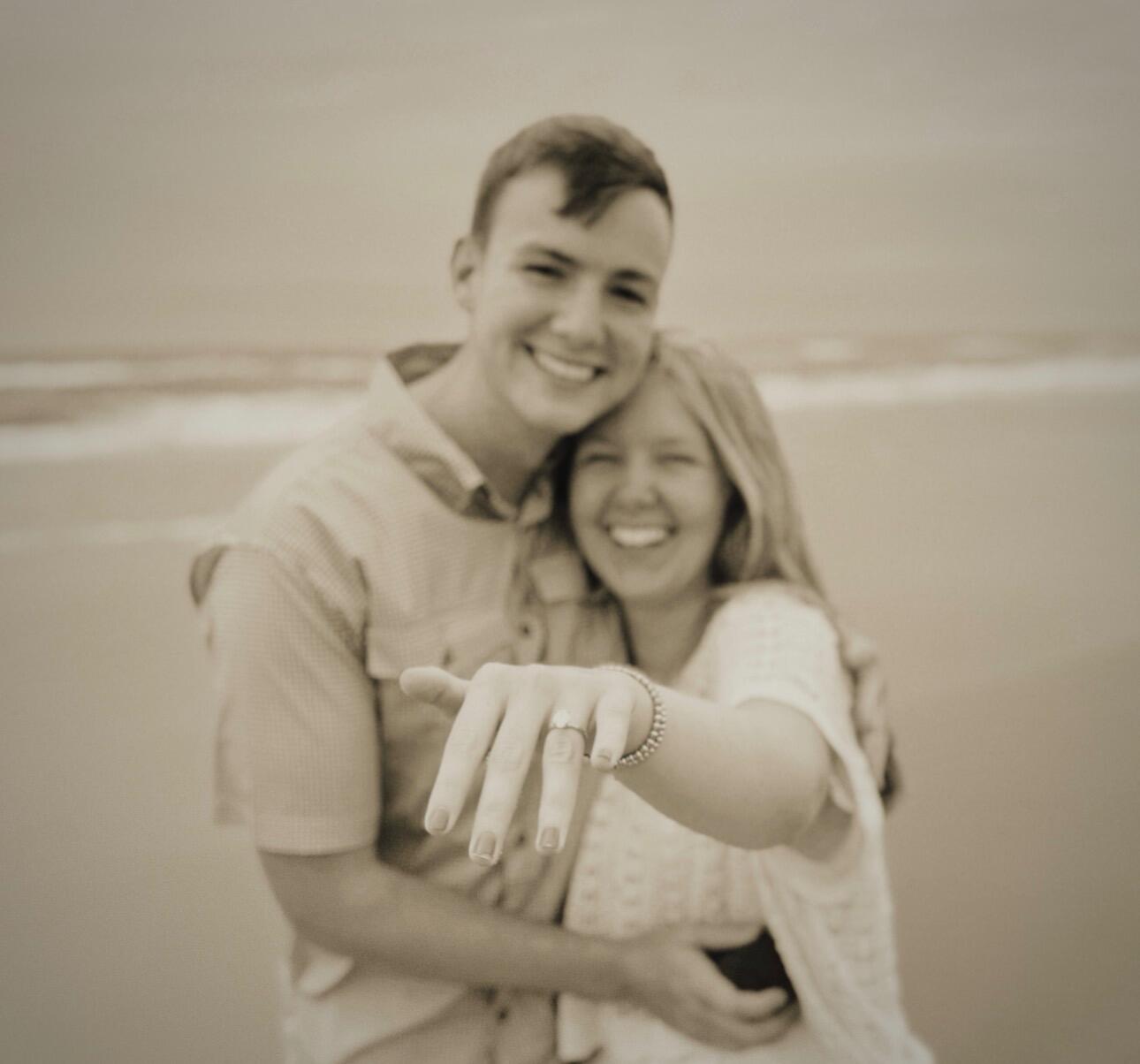 After "going to look at the airport near the dunes" and "finding seashells," Jacob got down on one knee and asked Rebecca to make him the happiest man alive by marrying him and becoming his wife! She joyfully and excitedly said "yes!" 