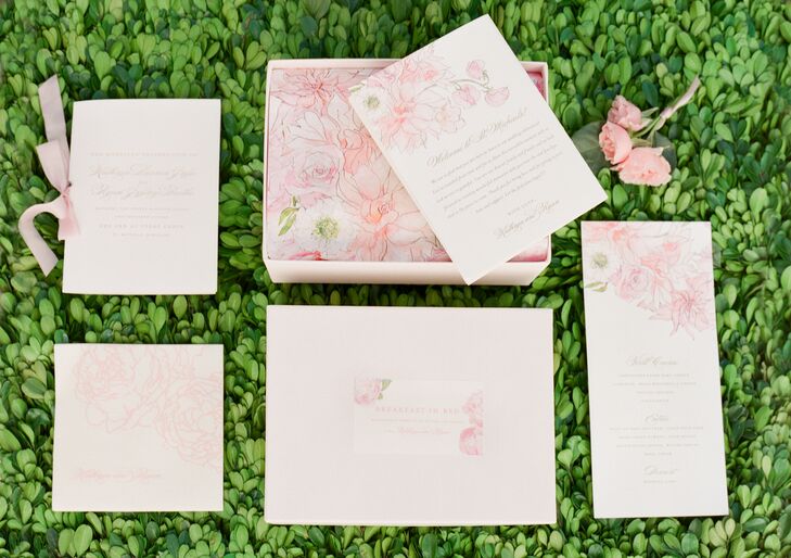 A custom botanical watercolor design by Inslee was a unifying element through the invitation suite.