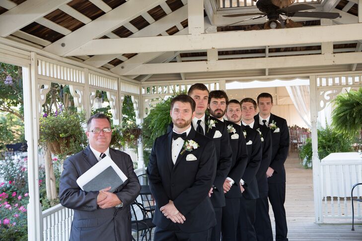 Groomsmen in Black Tie and White Floral Buttonholes